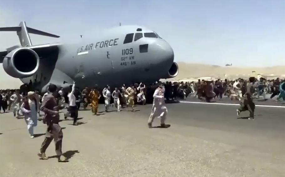 Afghans Falling From Plane
as Panic Provokes Escape