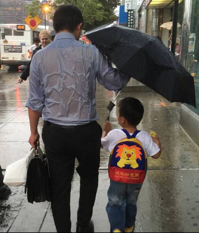 For The Sake Of The Child, He Proudly Drenched In Rain!